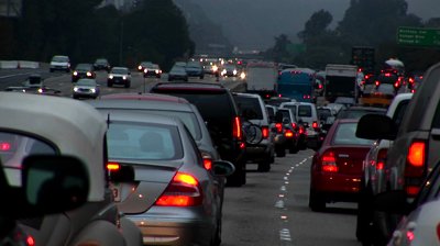 stock-footage-traffic-drives-slowly-on-a-crowded-freeway